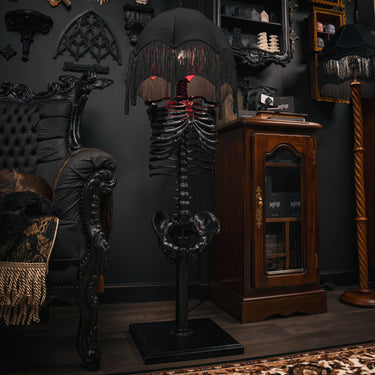 skeleton floor lamp in gothic living room with victorian gothic style decor black room