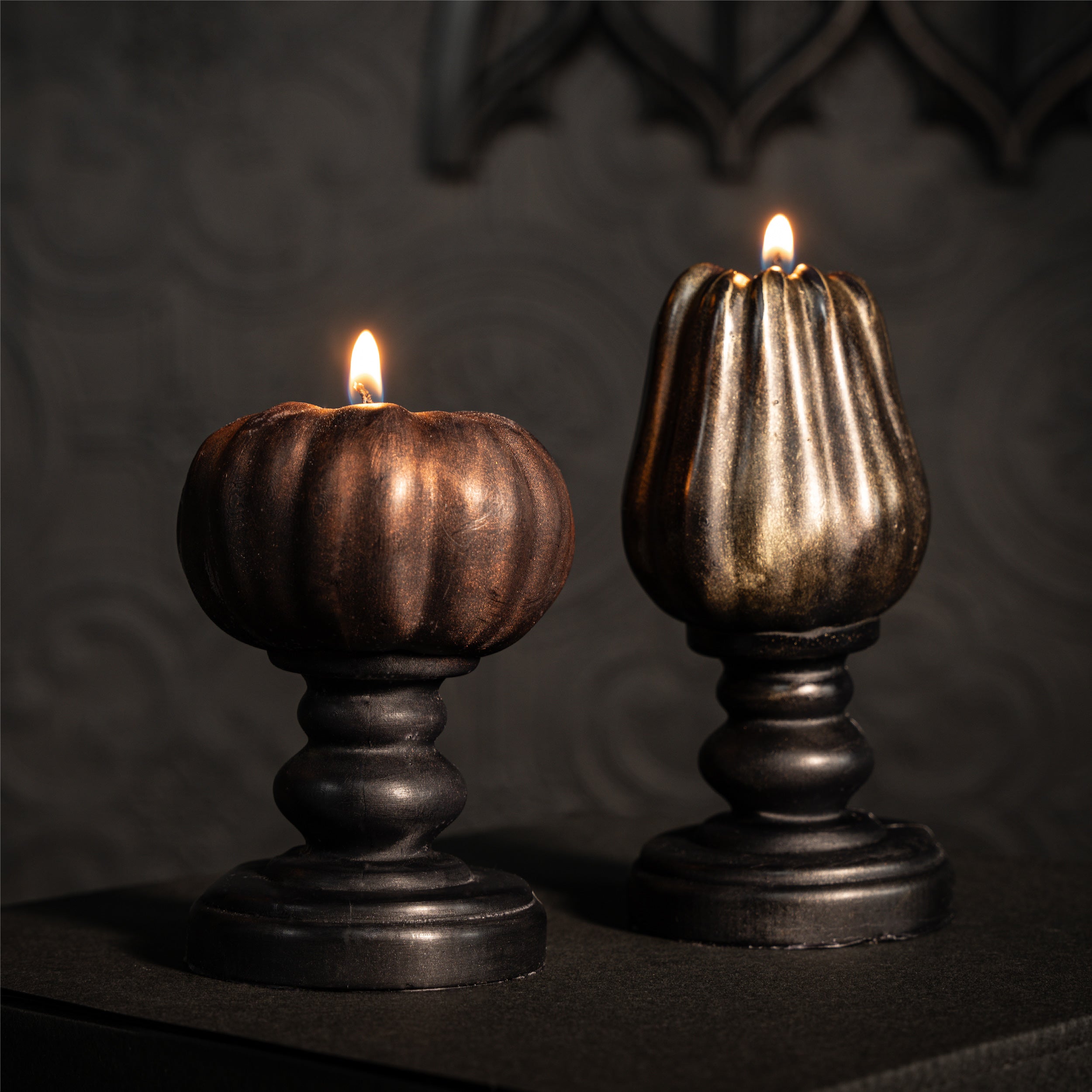 bronze pumpkin candle on black plinth by the blackened teeth gothic home decor 