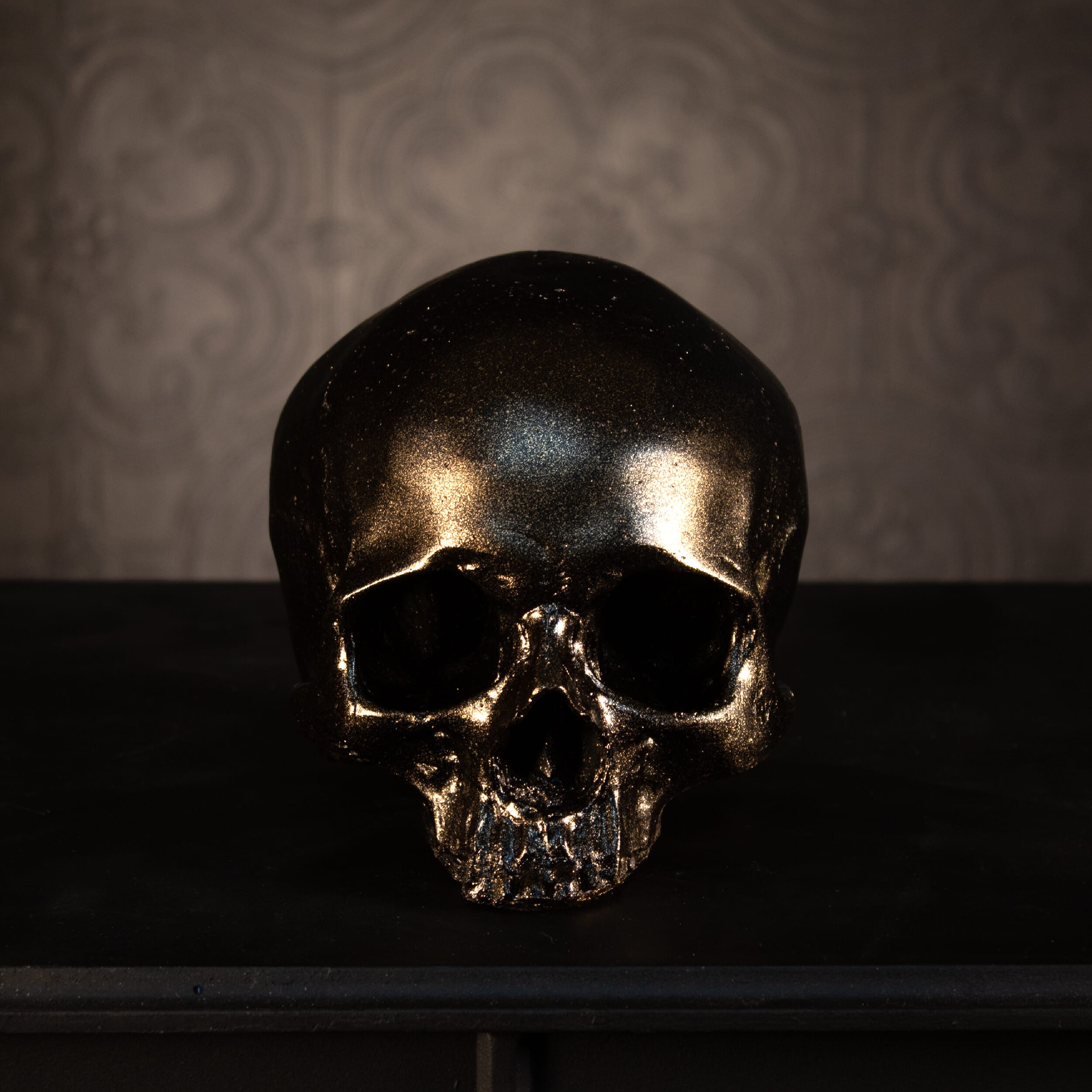 human replica skull ornament blackened gold